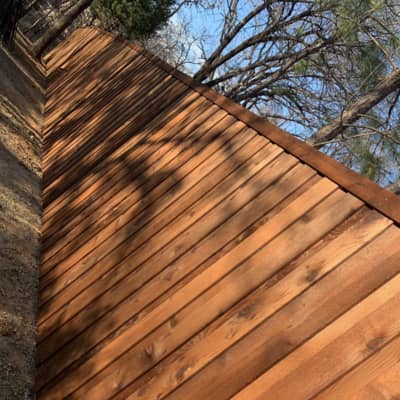 When hail damaged roofs, the fence is usually in need of replacement too. Denton Roofing Company specializes in replacing wooden fences like this one 